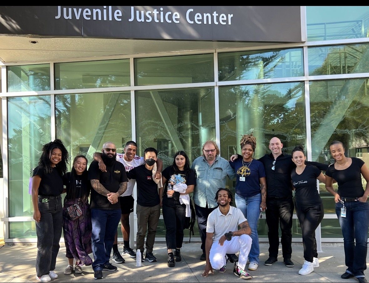 Community partners gathered outside a juvenile justice center